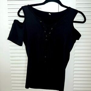 Solid black polyester cold shoulder lace up front blouse.